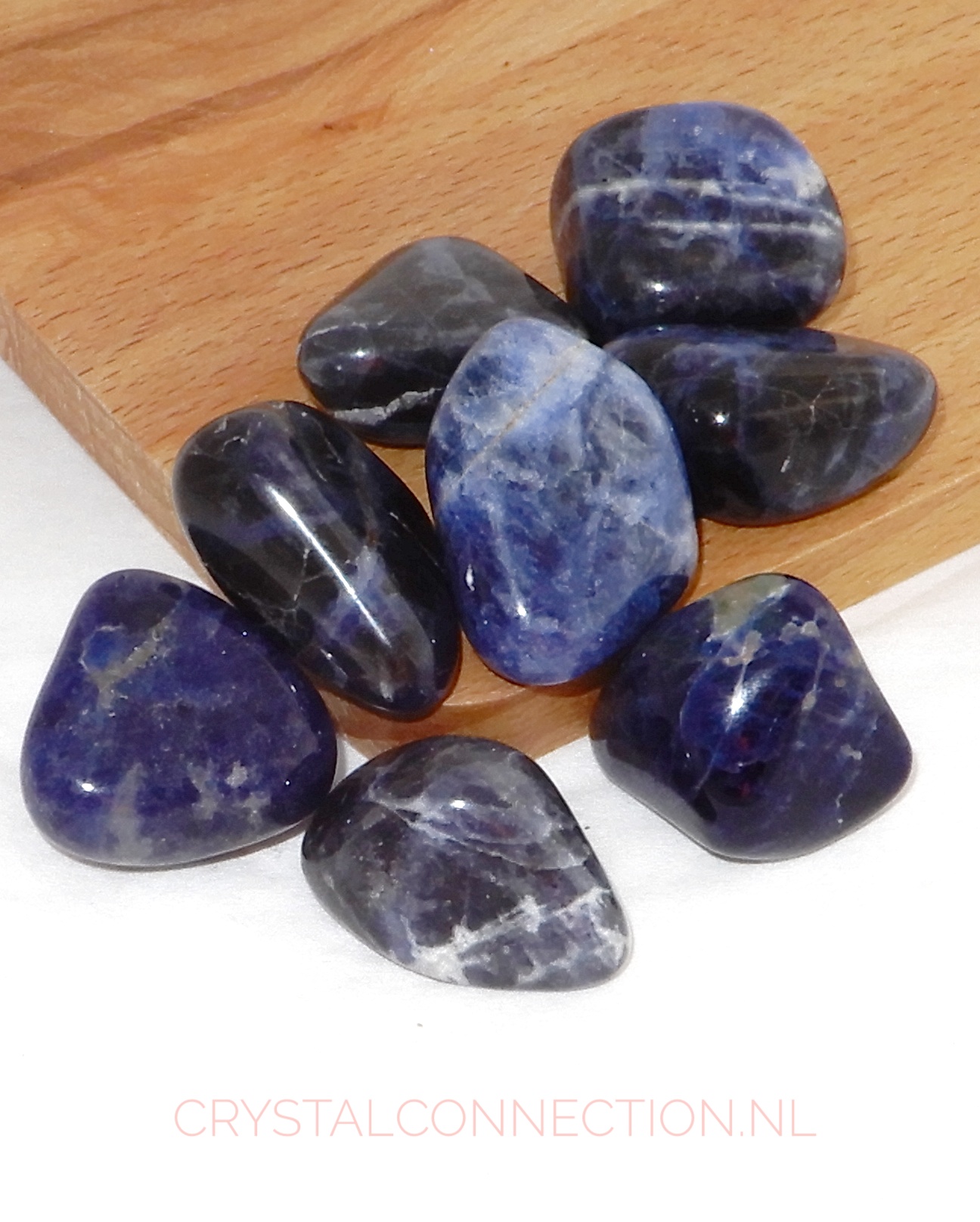 Sodaliet trommelstenen